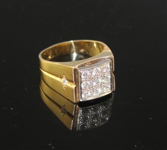 An 18k yellow metal and nine stone pave set diamond square signet ring, size W/X, gross 14.5 grams,